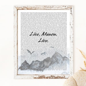 May include: A watercolor illustration of a mountain range with a quote from a fantasy novel. The quote reads "Live, Manon. Live." The text is in black and the mountains are painted in shades of gray and blue.