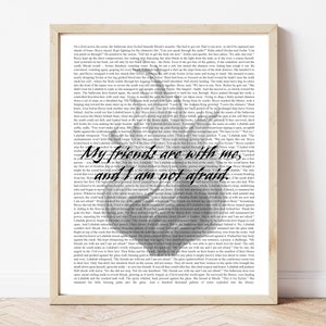 May include: A book cover with a dark background and a white heart with the text "My friends are with me, and I am not afraid." The text is in a bold, handwritten font.