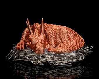 Portaclips con forma de nido de dragón