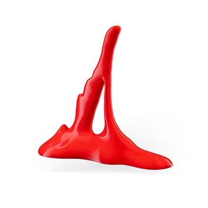 May include: A bright red abstract sculpture made of a smooth, glossy material. The sculpture is shaped like a tall, thin tower with a wide base.