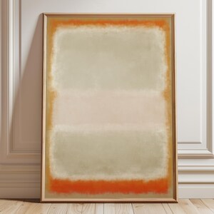 Könnte beinhalten: Abstrakter Kunstdruck in einem Holzrahmen. Das Kunstwerk zeigt eine rechteckige Komposition mit einem hellgrünen oberen Bereich, einem rosa mittleren Bereich und einem leuchtend orangefarbenen unteren Bereich. Die Ränder sind orange umrandet.