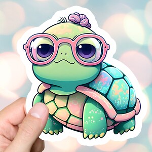 May include: A green turtle wearing pink glasses and a pink flower on its head. The turtle has a green and pink shell with iridescent details.