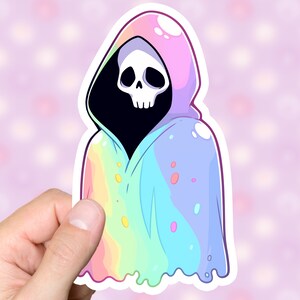 May include: A sticker of a cartoon skeleton wearing a rainbow-colored hooded cloak. The cloak is dripping with colorful slime.