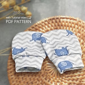 May include: A pair of baby mittens with a gray and white chevron pattern and blue elephant illustrations. The cuffs are a solid gray. The text "PDF PATTERN" is visible in the upper left corner.