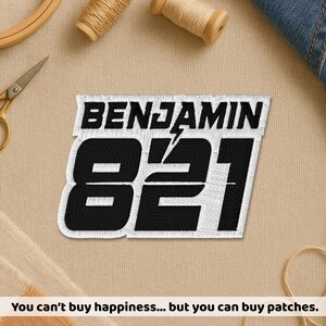 May include: Embroidered patch featuring the name "BENJAMIN" above the number "821" in black on a white background. The patch has a lightning bolt design. The text "You can't buy happiness... but you can buy patches" is at the bottom.
