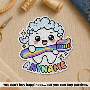 May include: Embroidered patch of a smiling tooth character holding a rainbow toothbrush. The patch has a blue cloud-like design above the tooth and the word "ANYNAME" below. Gold stars and the text "You can't buy happiness... but you can buy patches" are also visible.