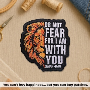 May include: Embroidered patch with a lion's head in orange and black. The patch reads "DO NOT FEAR FOR I AM WITH YOU" and "ISAIAH 41:10". The patch has a black border. Ideal for jackets, bags, or other fabric items.