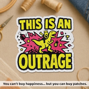 May include: A rectangular embroidered patch featuring the yellow text THIS IS AN OUTRAGE. The design includes a yellow dinosaur with a rider, set against a bright pink starburst background with small black icons including a bomb, trophy, and pineapple.