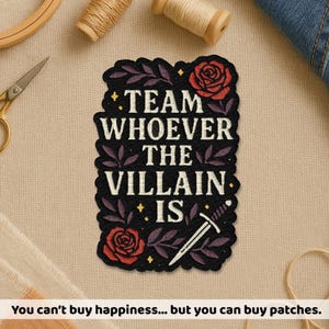 May include: Embroidered black patch with the text "TEAM WHOEVER THE VILLAIN IS", red roses, and a sword design. The patch is surrounded by purple leaves and yellow stars. The text "You can't buy happiness... but you can buy patches" is at the bottom.