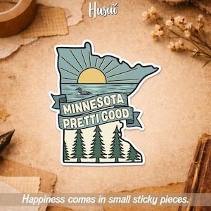 May include: A sticker in the shape of Minnesota with a lake scene, sun, and pine trees. The text "MINNESOTA PRETTI GOOD" is on a banner. The sticker has a white border and the text "Happiness comes in small sticky pieces."