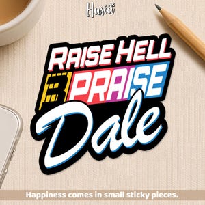 May include: A sticker with the words "RAISE HELL PRAISE Dale" in white, blue, red, yellow, and purple. The sticker has a black border and a white outline. The text "Happiness comes in small sticky pieces" is at the bottom.