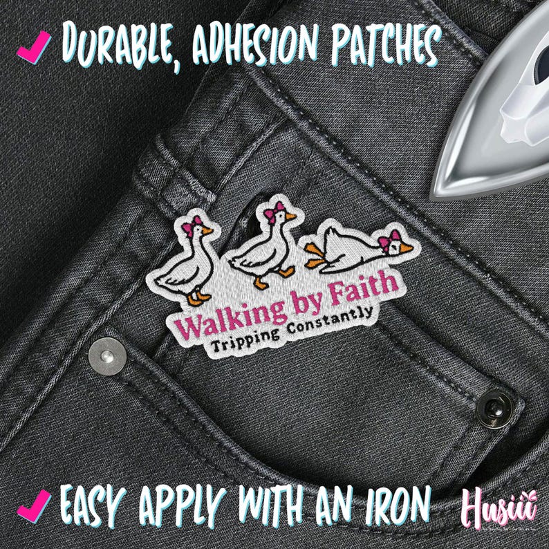 May include: Embroidered patch with three cartoon geese wearing pink bows, the text "Walking by Faith, Tripping Constantly" on grey denim. The patch is designed for iron-on application.