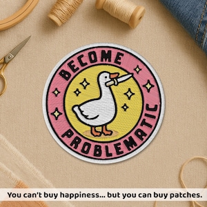 May include: Embroidered patch with a white goose holding a knife, surrounded by the words "BECOME PROBLEMATIC." The patch has a pink and yellow color scheme with star accents. The text at the bottom says "You can't buy happiness... but you can buy patches."