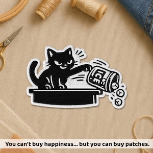 May include: Black cat patch with a white border. The cat is pouring ice from a container. The text on the container reads "ICE". The patch also includes the text "You can't buy happiness... but you can buy patches."
