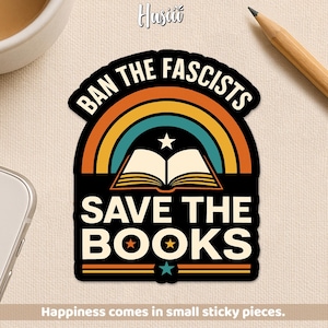 May include: A sticker featuring the text "BAN THE FASCISTS" above a rainbow design. Below the rainbow is an open book with a star above it, and the words "SAVE THE BOOKS". The sticker has a black border and a white background.