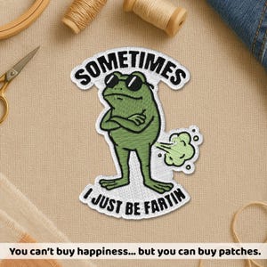 May include: A white ceramic mug with a black handle and the text "But First, Coffee" in a black, bold font. The mug is sitting on a white surface.