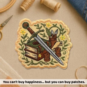 May include: Embroidered patch featuring a sword, books, and art supplies. The patch has a yellow border with floral and leaf accents. The text at the bottom reads, "You can't buy happiness... but you can buy patches."