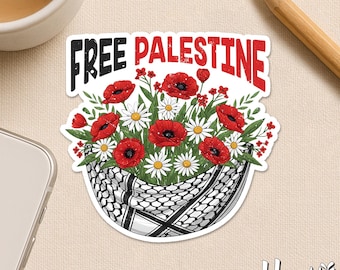May include: A sticker with the words "FREE PALESTINE" in black and red, above a floral arrangement of red poppies and white daisies. The flowers are in a black and white keffiyeh-patterned basket.