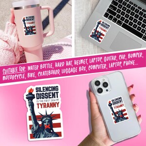 May include: A sticker featuring the Statue of Liberty with a red, white, and blue design and the text "SILENCING DISSENT IS THE FIRST SIGN OF TYRANNY." The sticker is shown on a pink tumbler, a laptop, and a phone.