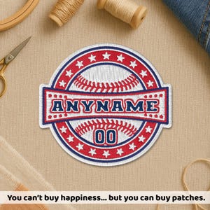 May include: Embroidered baseball patch with a white baseball design, red and blue accents, and the text "ANYNAME" and "00". The patch is surrounded by a red and blue border with white stars. The text at the bottom says "You can't buy happiness... but you can buy patches."