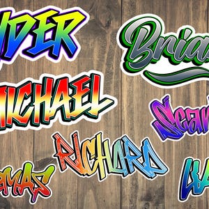 May include: Eight colorful, stylized name stickers with a graffiti-style font. The names are: Ryder, Brian, Michael, Scarlett, Richard, Liam, and Thomas.