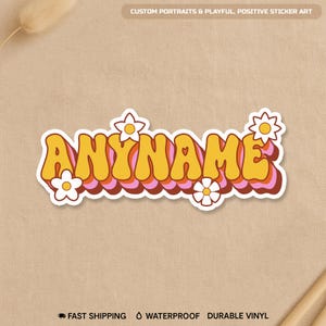 May include: A retro-style sticker with the word "ANYNAME" in yellow and orange bubble letters, outlined in white. The sticker has a pink and orange layered effect and is decorated with white daisy flowers. The text "CUSTOM PORTRAITS & PLAYFUL, POSITIVE STICKER ART" is at the top.
