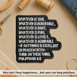 May include: Black embroidered patch with white text quoting Philippians 4:8: "Whatever is true... think on these things." The patch is surrounded by sewing supplies. The text at the bottom reads: "You can't buy happiness... but you can buy patches."