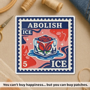 May include: Embroidered patch with a postage stamp design. The patch features the words "ABOLISH ICE" and a graphic of a rose in a block of ice. The background is pink and blue. The text at the bottom reads: "You can't buy happiness... but you can buy patches."