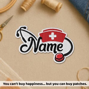 May include: Embroidered patch featuring a nurse's cap with a white cross, a stethoscope, and the word "Name" in a cursive font. The patch is white, red, and black, and is likely for medical professionals.