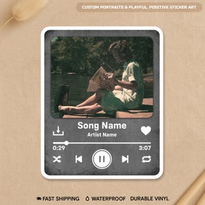 May include: A sticker featuring a grayscale image of a person reading a magazine by a lake, framed within a music player interface. The design includes a song title, artist name, and playback controls. The sticker is labeled "Custom Portraits & Playful, Positive Sticker Art."