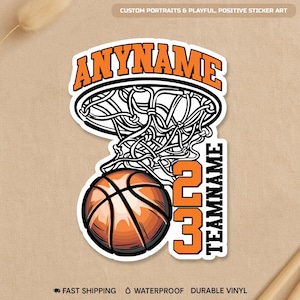 May include: A basketball sticker with an orange and black design. The sticker features a basketball, net, and the text "ANYNAME" above the net. The number "23" and the word "TEAMNAME" are also included. The sticker is labeled "CUSTOM PORTRAITS & PLAYFUL, POSITIVE STICKER ART."