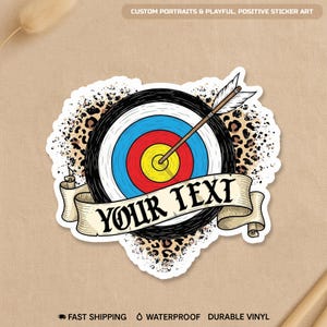 May include: A sticker featuring a bullseye target with a drawn arrow. The target has concentric circles in yellow, red, blue, and white. A banner below reads "YOUR TEXT". The sticker has a leopard print border and the text "CUSTOM PORTRAITS & PLAYFUL, POSITIVE STICKER ART".