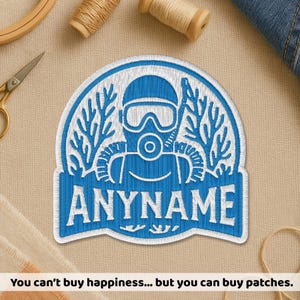 May include: A blue and white embroidered patch with a scuba diver design and the name "ANYNAME". The patch has a white border and decorative elements. The text at the bottom says "You can't buy happiness... but you can buy patches."