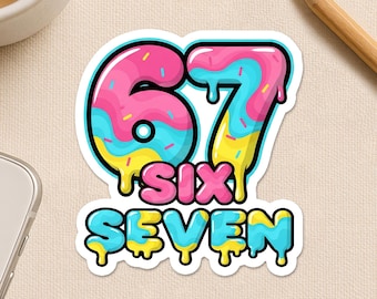 May include: A colorful sticker featuring the number "67" in a donut-style design with pink, blue, and yellow icing. The word "SIX SEVEN" is below the numbers. The sticker has a white border and the text "Happiness comes in small sticky pieces."