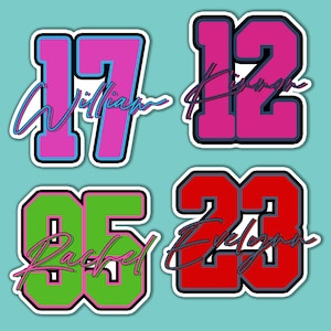 May include: Four colorful iron-on patches with numbers and names. The patches are pink, red, green, and purple with black outlines. The numbers are 17, 12, 05, and 23. The names are William, Kynan, Rachel, and Evelyn.