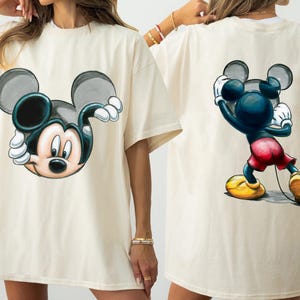 May include: A set of three ceramic mugs with a speckled, matte finish. The mugs are in shades of cream, light gray, and dark gray. Each mug has a simple, minimalist design, perfect for coffee or tea.