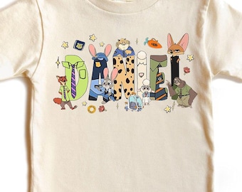 Koszulka z motywem postaci z filmu „Zwierzogród 2” z niestandardową nazwą Disney, koszulka z motywem postaci z filmu „Zwierzogród 2” z Judy Hopps i Nickiem Wilde’em, koszulka rodzinna z motywem wycieczki do Disneylandu, Magic Kingdom