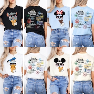 May include: A selection of t-shirts with Disney character designs. The shirts showcase Mickey Mouse, Minnie Mouse, and Donald Duck, each wearing sunglasses and holding snacks. Some shirts feature the text "Snack Around The World" and travel-themed stamps.