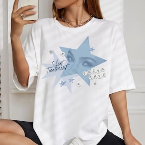 May include: A set of three ceramic mugs with a speckled, matte finish. The mugs are in shades of cream, light gray, and dark gray. Each mug has a simple, minimalist design and a rounded handle. Perfect for coffee or tea.