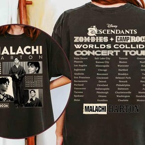 May include: Black t-shirt with a concert tour design. The front shows "MALACHI BARTON" with photos and "2026." The back lists tour cities under "DESCENDANTS ZOMBIES + CAMP ROCK WORLDS COLLIDE CONCERT TOUR."