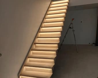May include: A wooden staircase with LED lights installed under each step. The staircase is lit up with a warm white glow.
