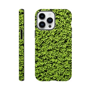 May include: A green phone case featuring a pattern of small, overlapping green leaves. The case is shown from multiple angles, highlighting the design on the back and sides. The case has a black border around the camera.