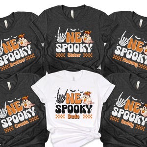 six t-shirts with a Halloween theme, featuring the text "NE SPOOKY" and various Halloween-related graphics and characters.