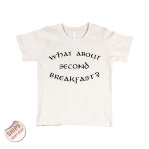 A white t-shirt with the text "WHAT ABOUT SECOND BREAKFAST?" printed on it.