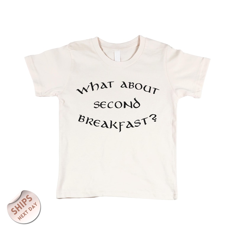 A white t-shirt with the text "WHAT ABOUT SECOND BREAKFAST?" printed on it.
