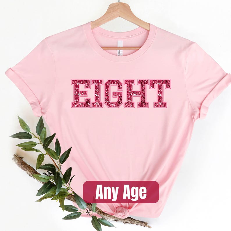 a pink shirt with the word fight on it