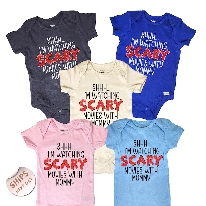 a group of baby bodysuits that say i'm watching scary movies with