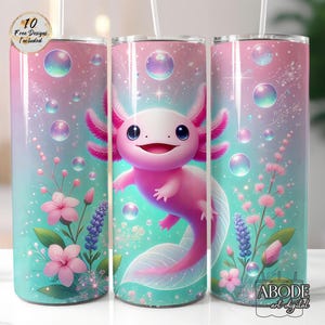 May include: A tumbler with a colorful design featuring a smiling pink axolotl, flowers, and bubbles. The background transitions from teal to pink. The text "10 Free Designs Included" is visible on the top left.