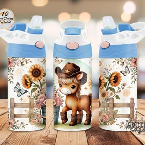 May include: Three water bottles with blue lids and white bodies. The bottles feature a floral design with sunflowers, butterflies, and a cartoon horse wearing a cowboy hat. The text "10 Free Designs Included" is visible.