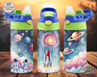 May include: Three water bottles with space-themed designs. Each bottle has a blue lid, green accents, and a colorful illustration of planets, stars, astronauts, and a rocket ship. The bottles are on a wooden surface.